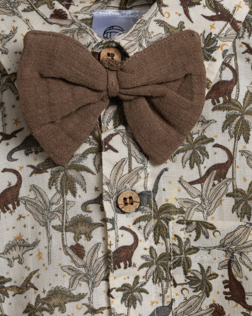 Close-up of Dinoro boys cotton co-ord set with cute dinosaur print and brown tie  – soft fabric detail.