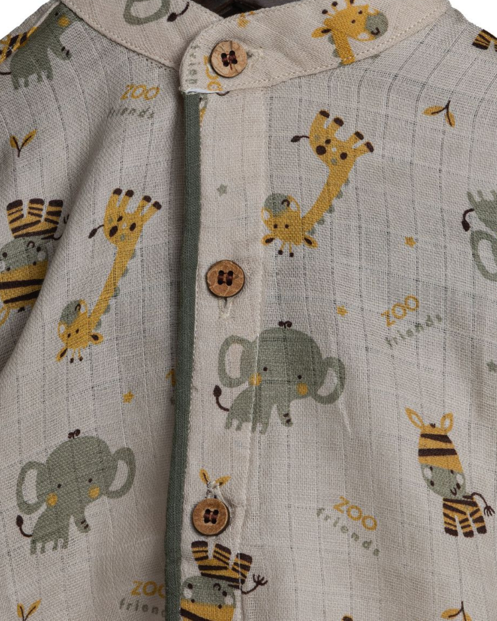 Boys's coords with animal prints including elephants, giraffes, and zebras on a neutral background.